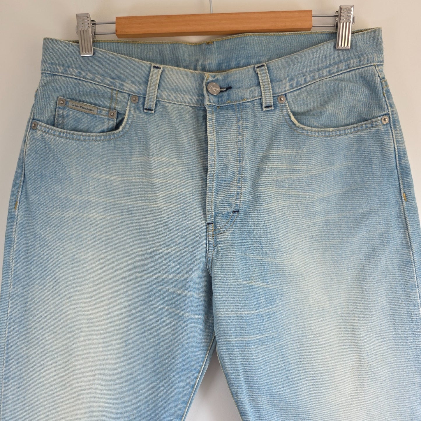 Calvin Klein light blue straight jeans, 100% cotton, classic five-pocket design.