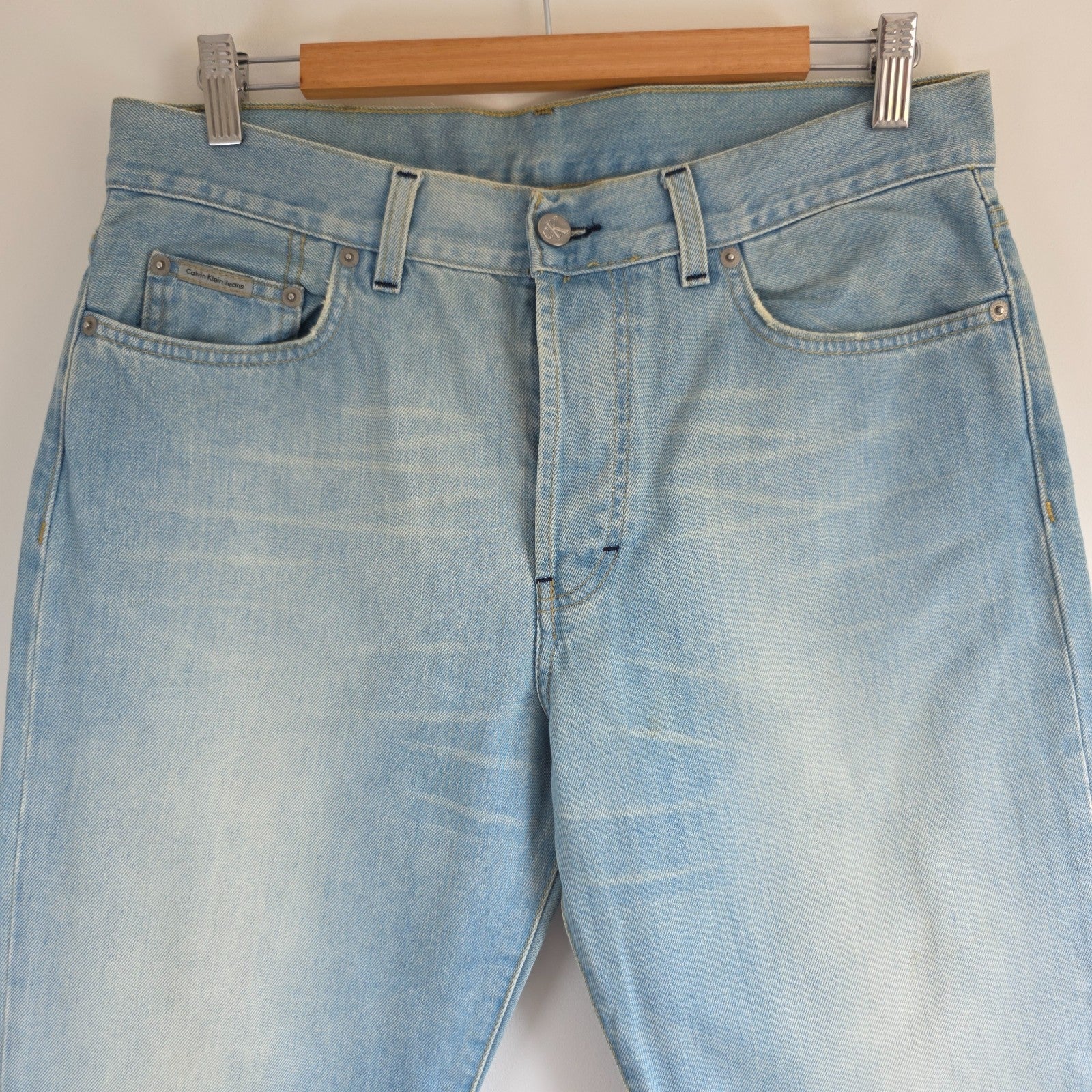 Calvin Klein light blue straight jeans, 100% cotton, classic five-pocket design.