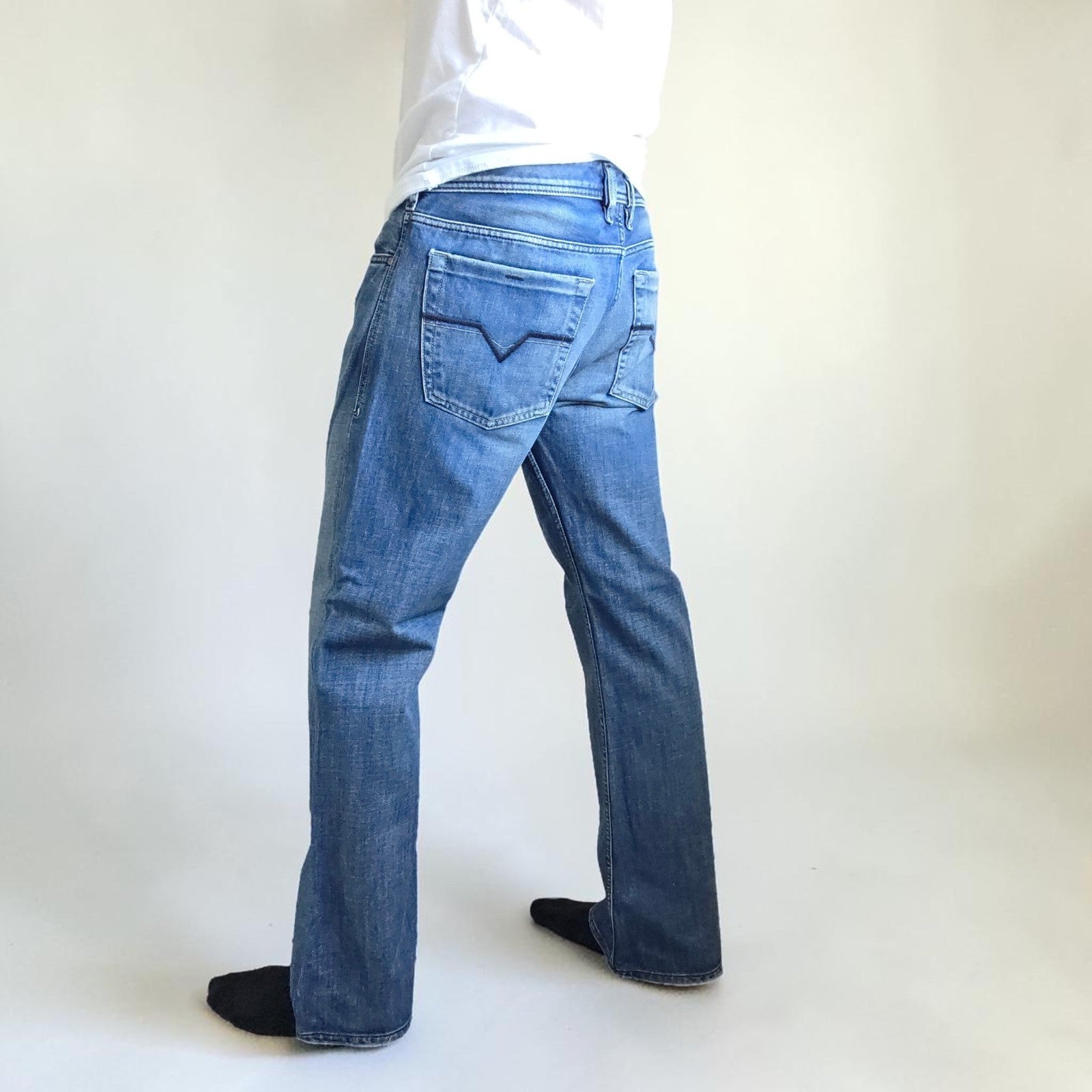 Diesel blue bootcut jeans with button fly and vintage Zathan fit, 100% cotton.