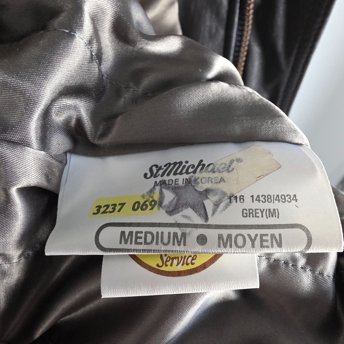 St Michael grey leather bomber jacket with utility pockets and elasticated waistband.