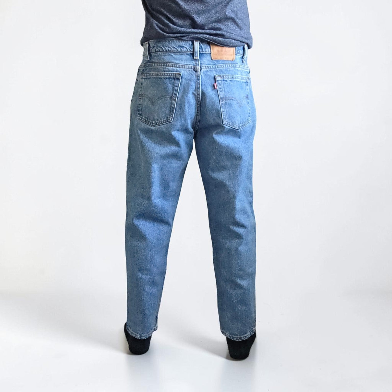 Levi's blue straight jeans vintage 550 relaxed fit with classic 90s silhouette.