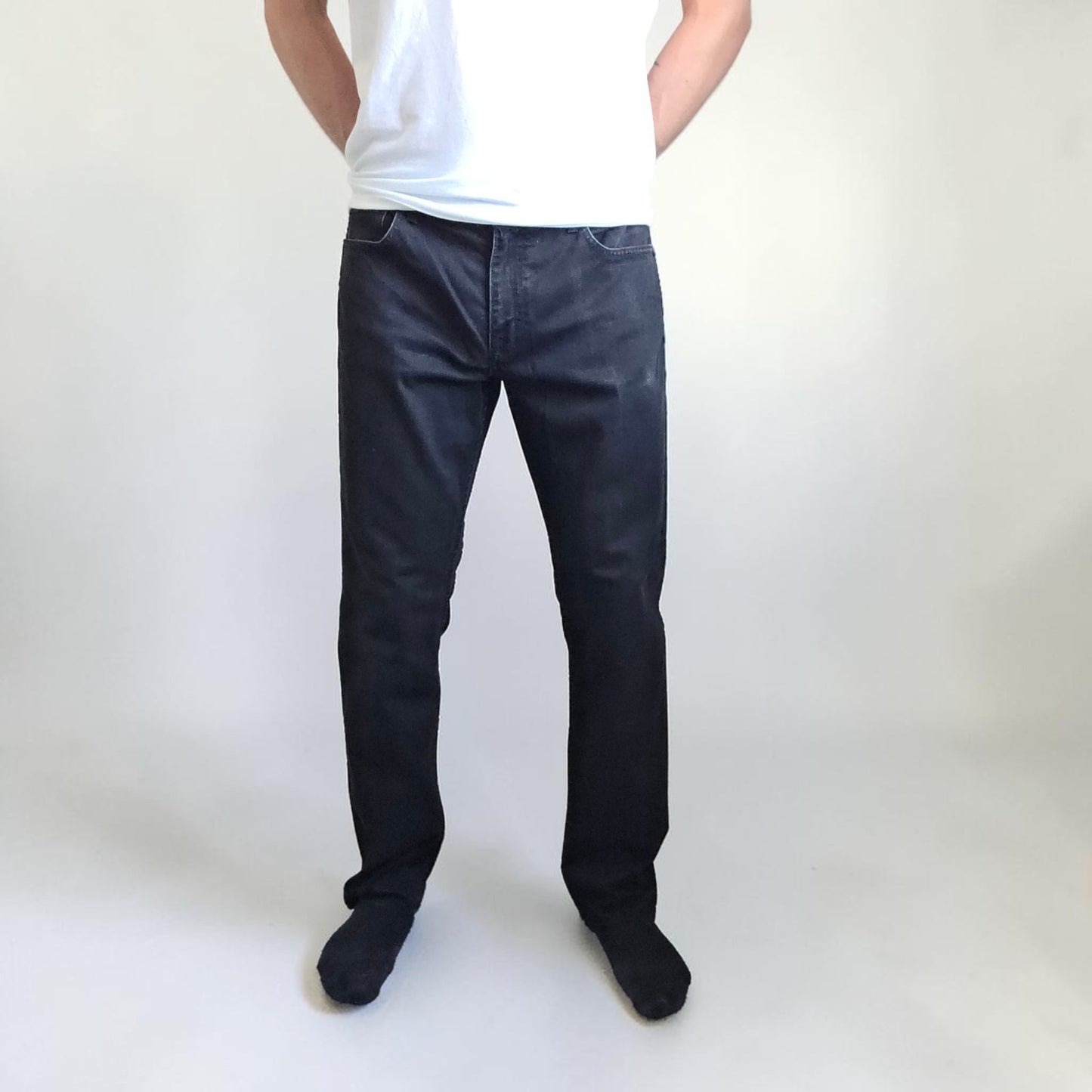 Calvin Klein black straight jeans with logo patch, stretch cotton blend, slim fit design.