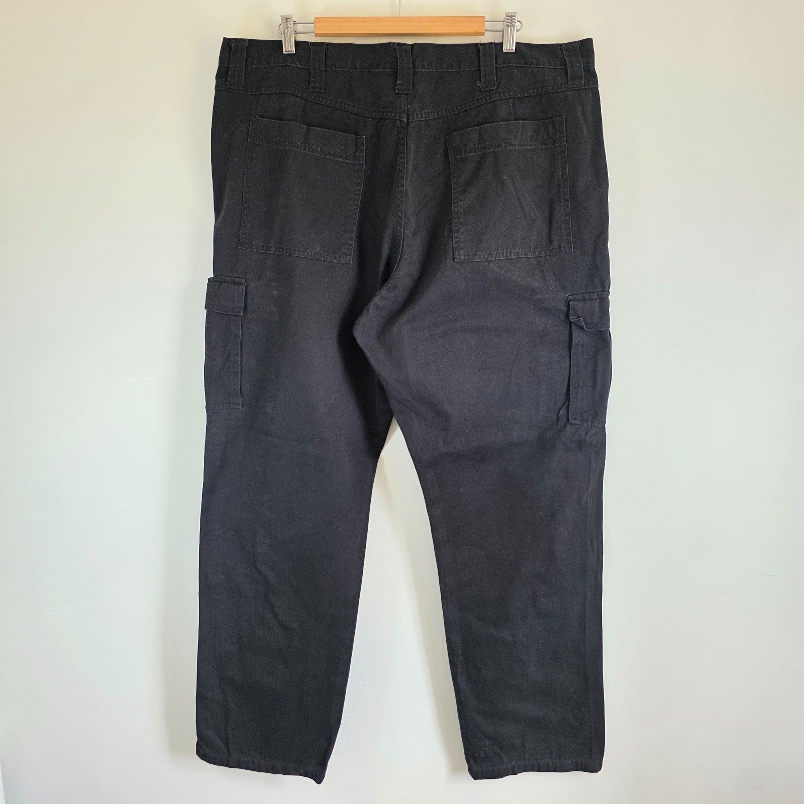Wrangler black cargo trousers relaxed fit with utility pockets and durable cotton material.