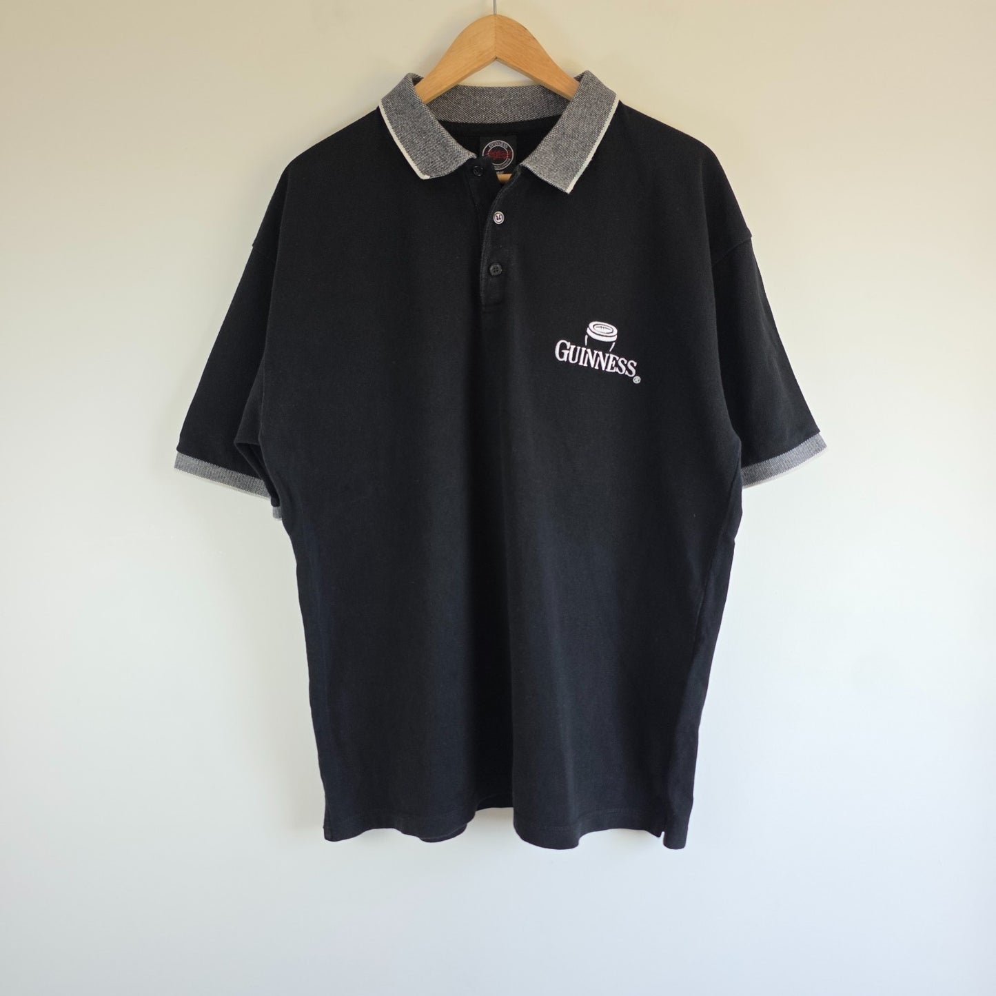 Guinness black polo shirt embroidered logo, 100% cotton, vintage style.