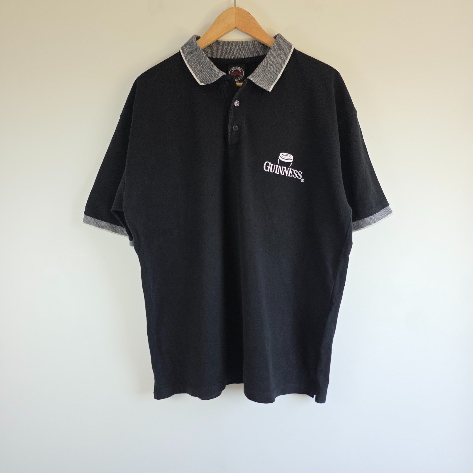 Guinness black polo shirt embroidered logo, 100% cotton, vintage style.
