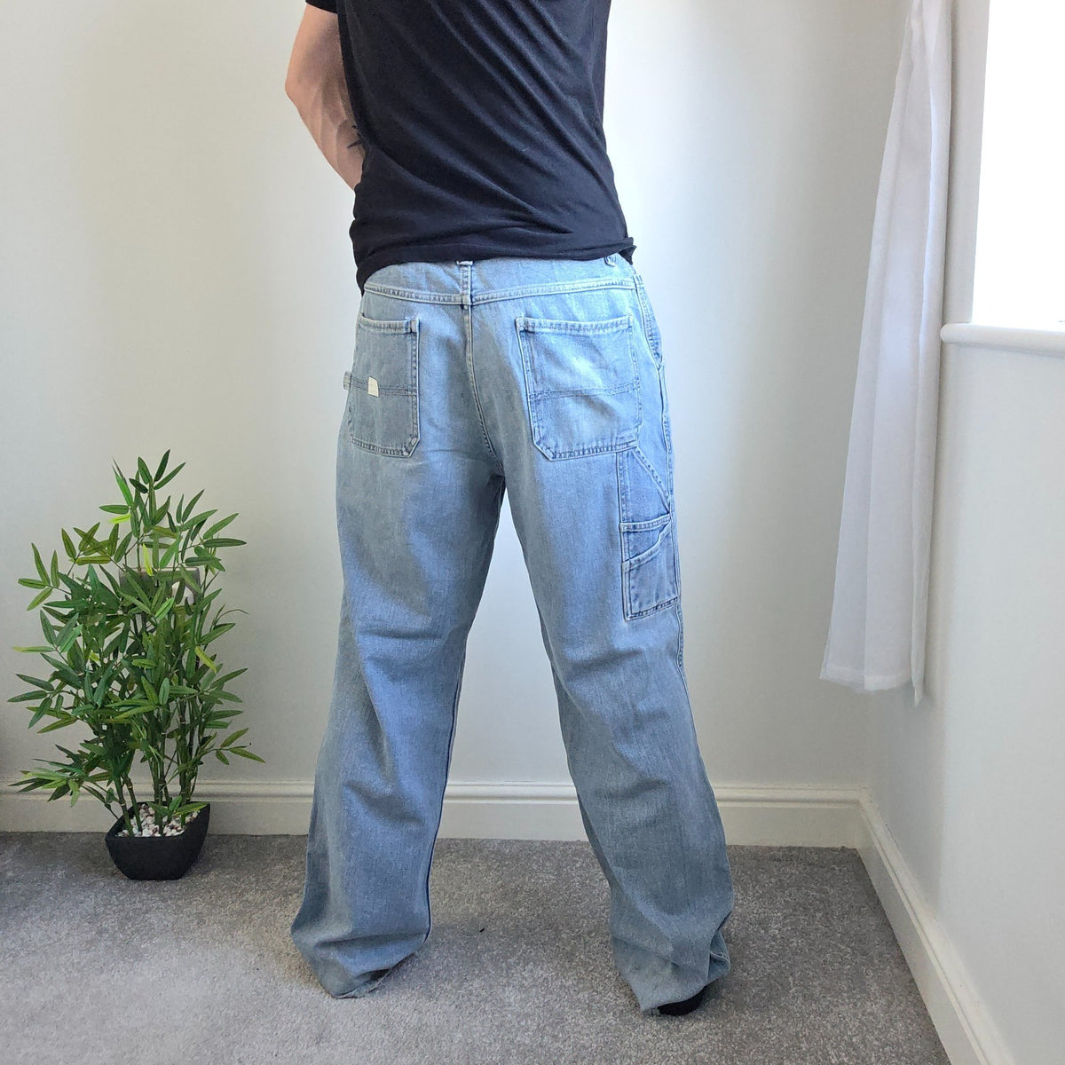 Old Navy blue carpenter jeans with hammer loop and utility pockets, 100% cotton.
