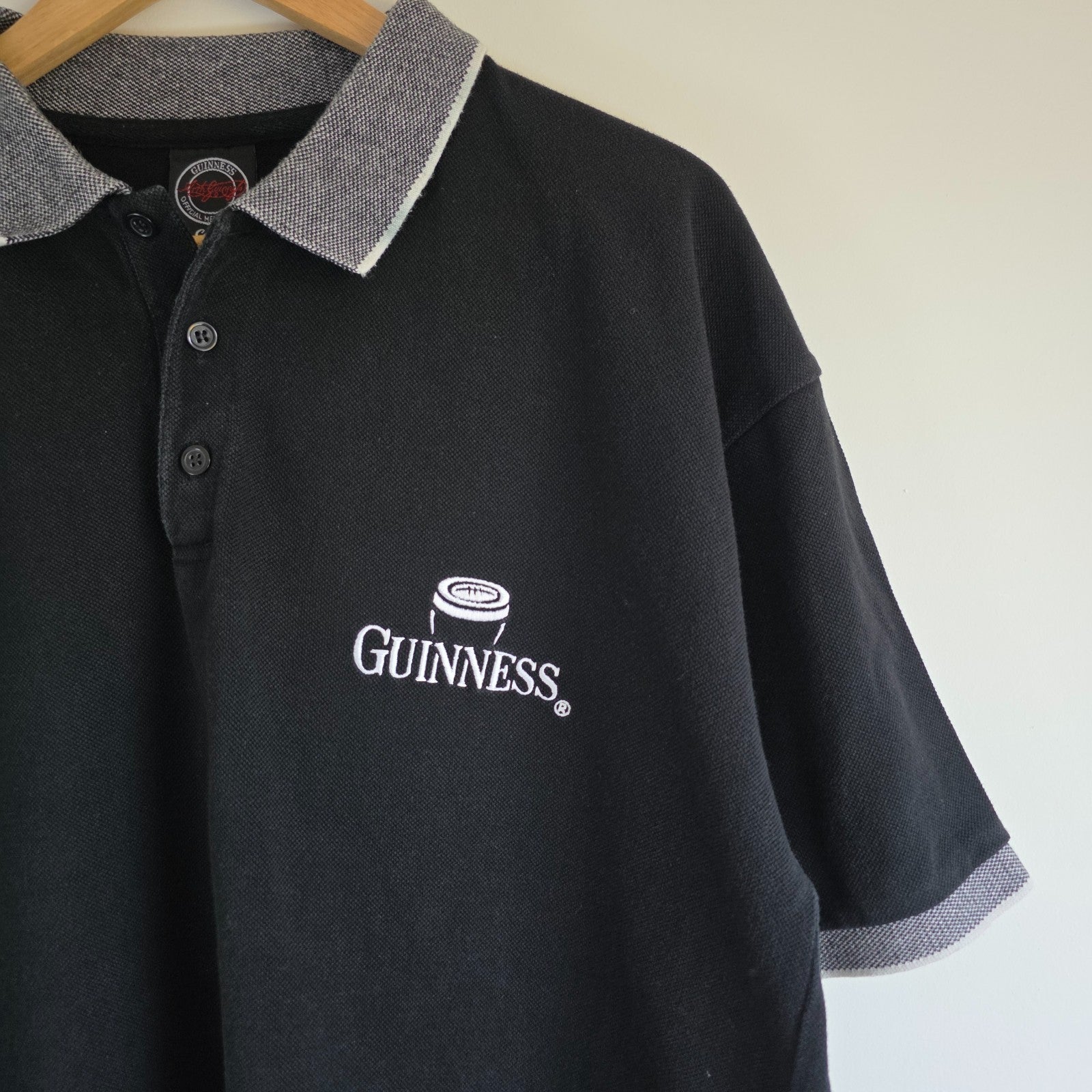 Guinness black polo shirt embroidered logo, 100% cotton, vintage style.