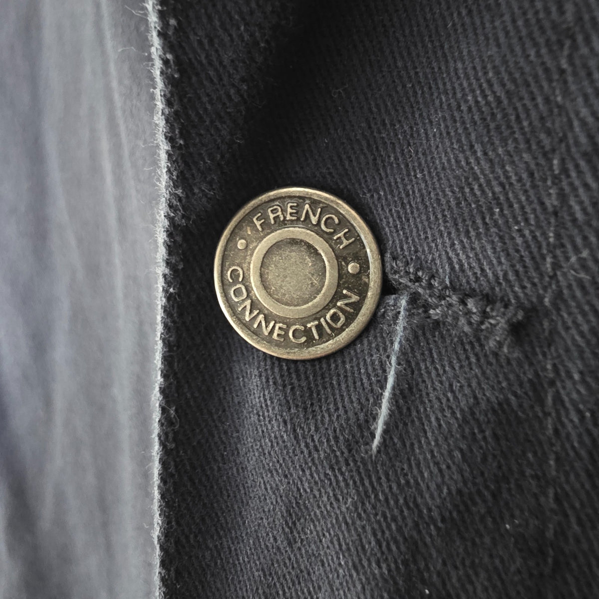 French Connection blue chore jacket with three patch pockets and metal button fastening.
