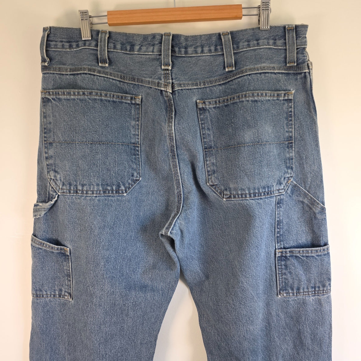 Faded Glory blue carpenter jeans with hammer loop and utility pockets, 100% cotton.