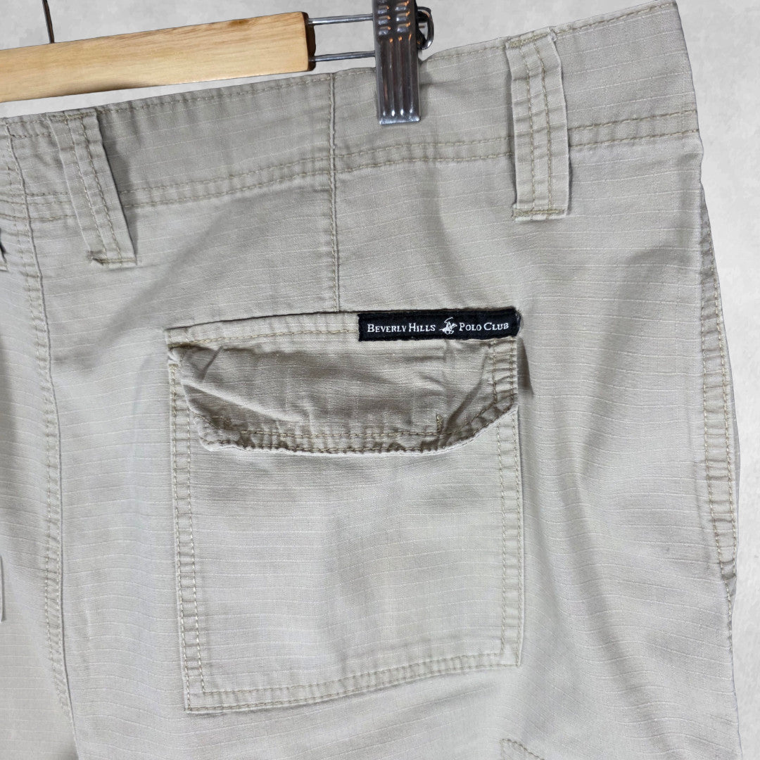 Polo Ralph Lauren beige cargo trousers with multiple pockets and straight leg cut.