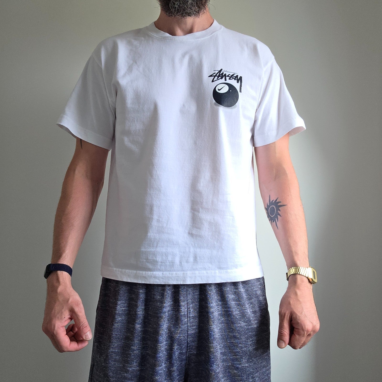 Stüssy x Nike white t-shirt with large 8 Ball back print and cotton material.