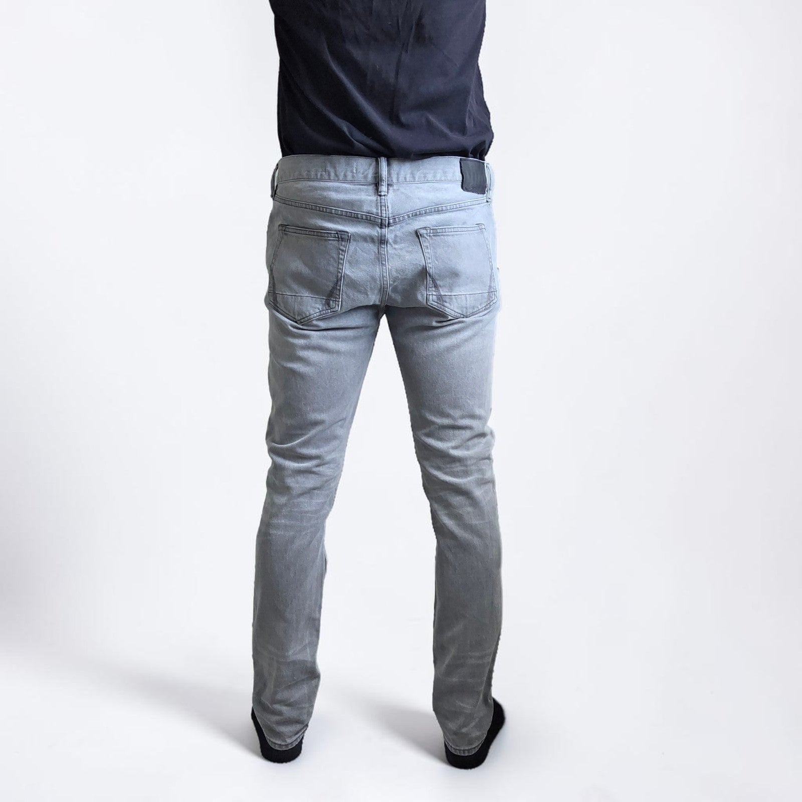 AllSaints grey slim jeans with button fly and stretch cotton elastane blend.