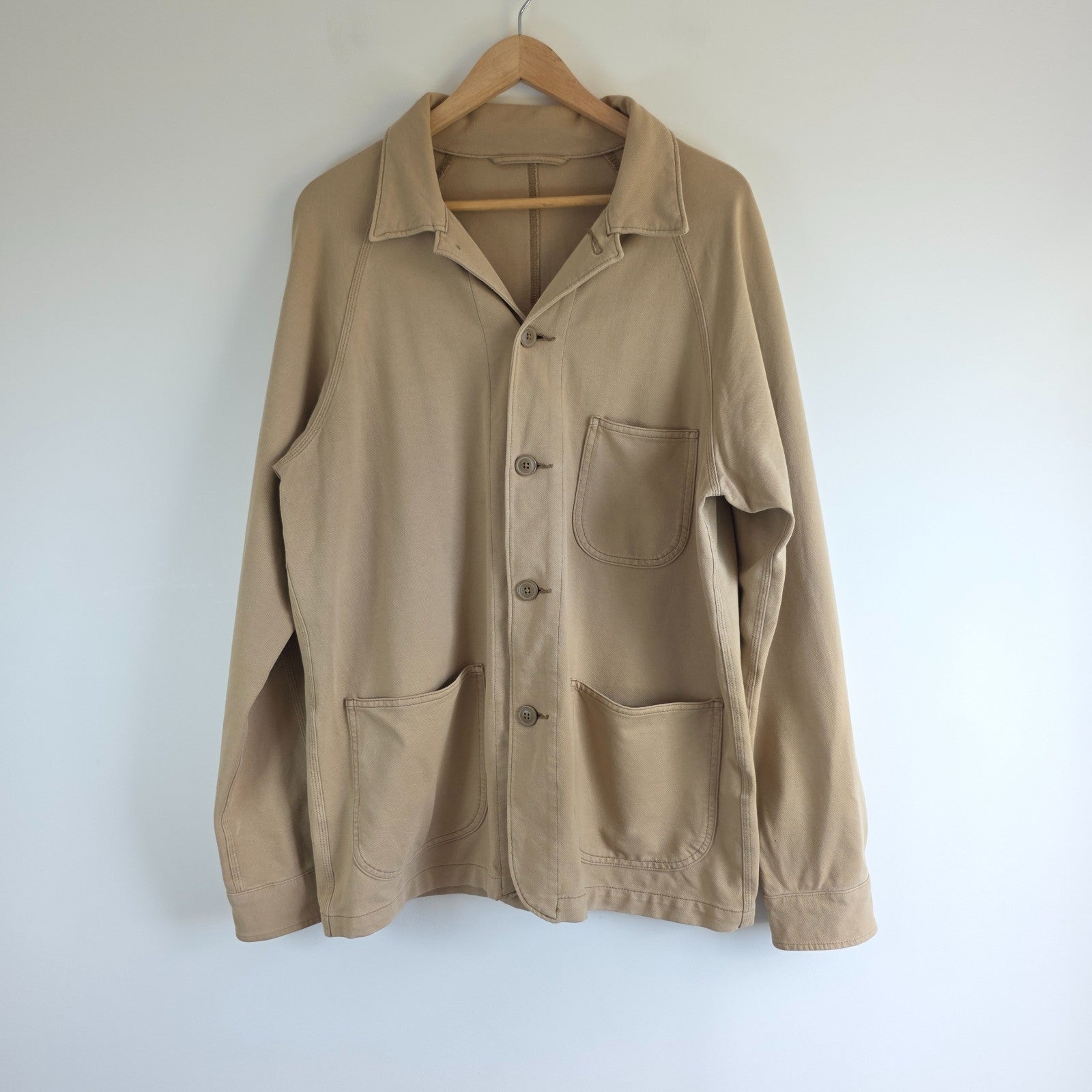 Uniqlo beige chore jacket medium cotton blend with subtle stretch and classic workwear design.