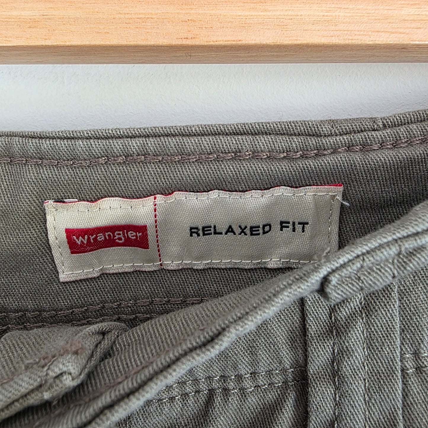 Wrangler khaki cargo trousers with utility pockets and cotton stretch fabric.