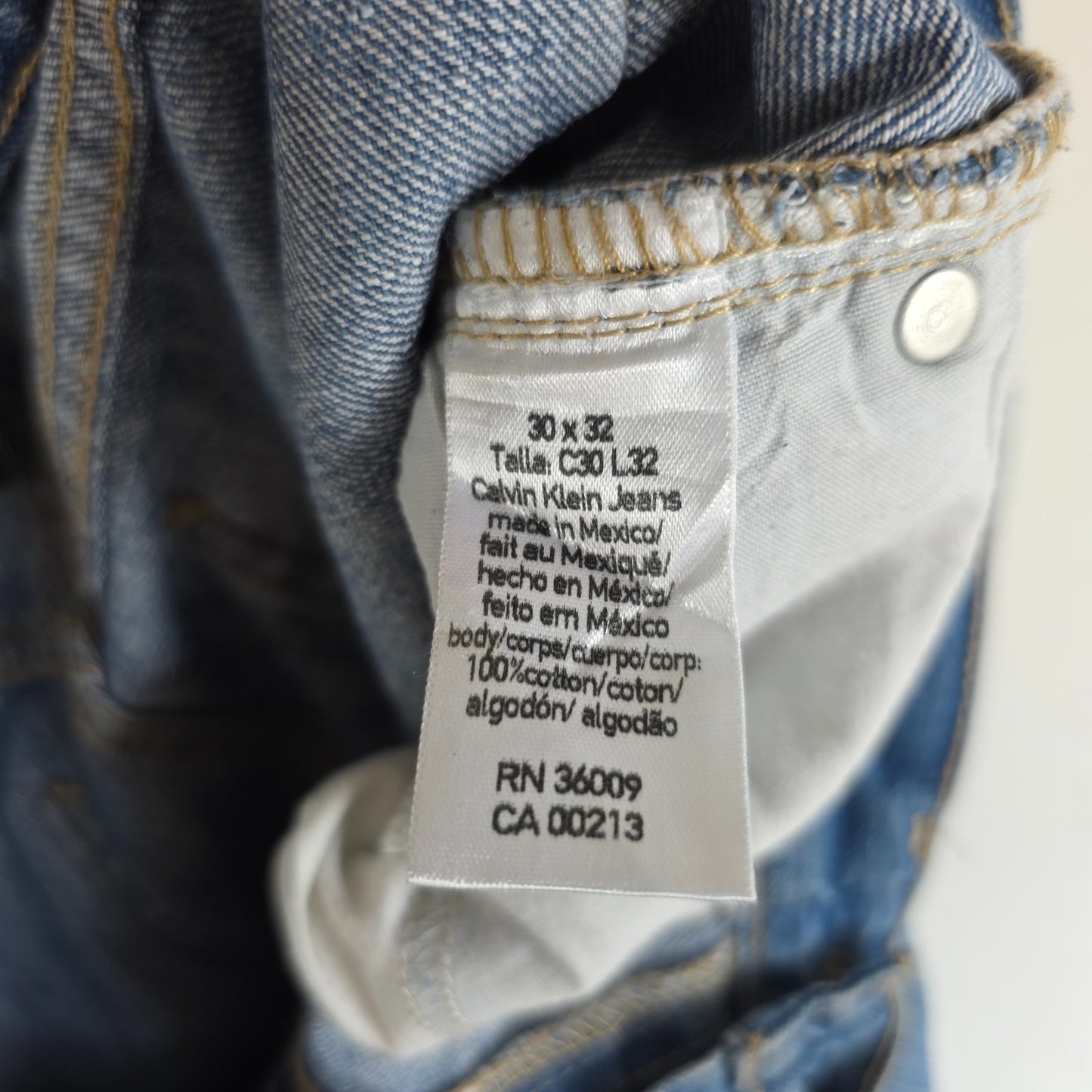 Calvin Klein blue straight jeans 100% cotton with relaxed fit and subtle logo detail.