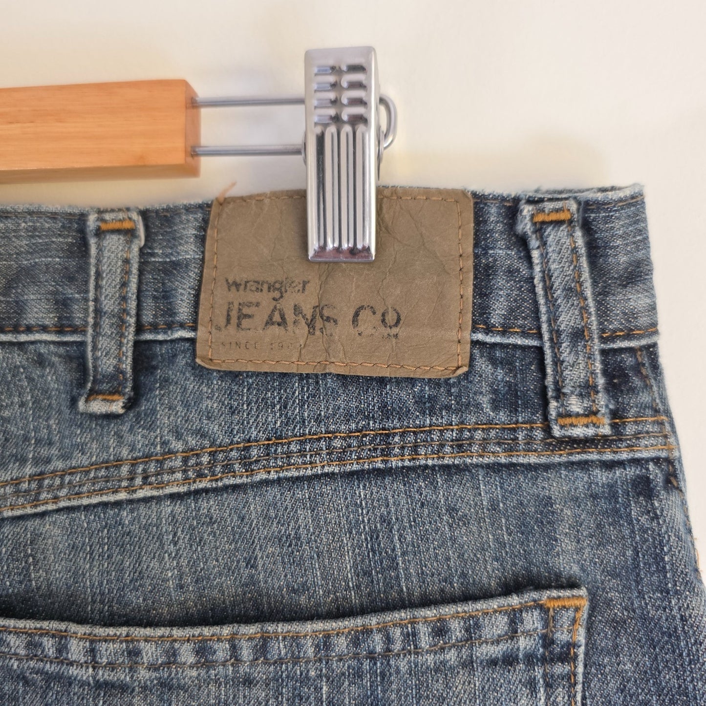 Wrangler blue straight jeans with relaxed fit, 100% cotton, professional hemmed to 30 inches.