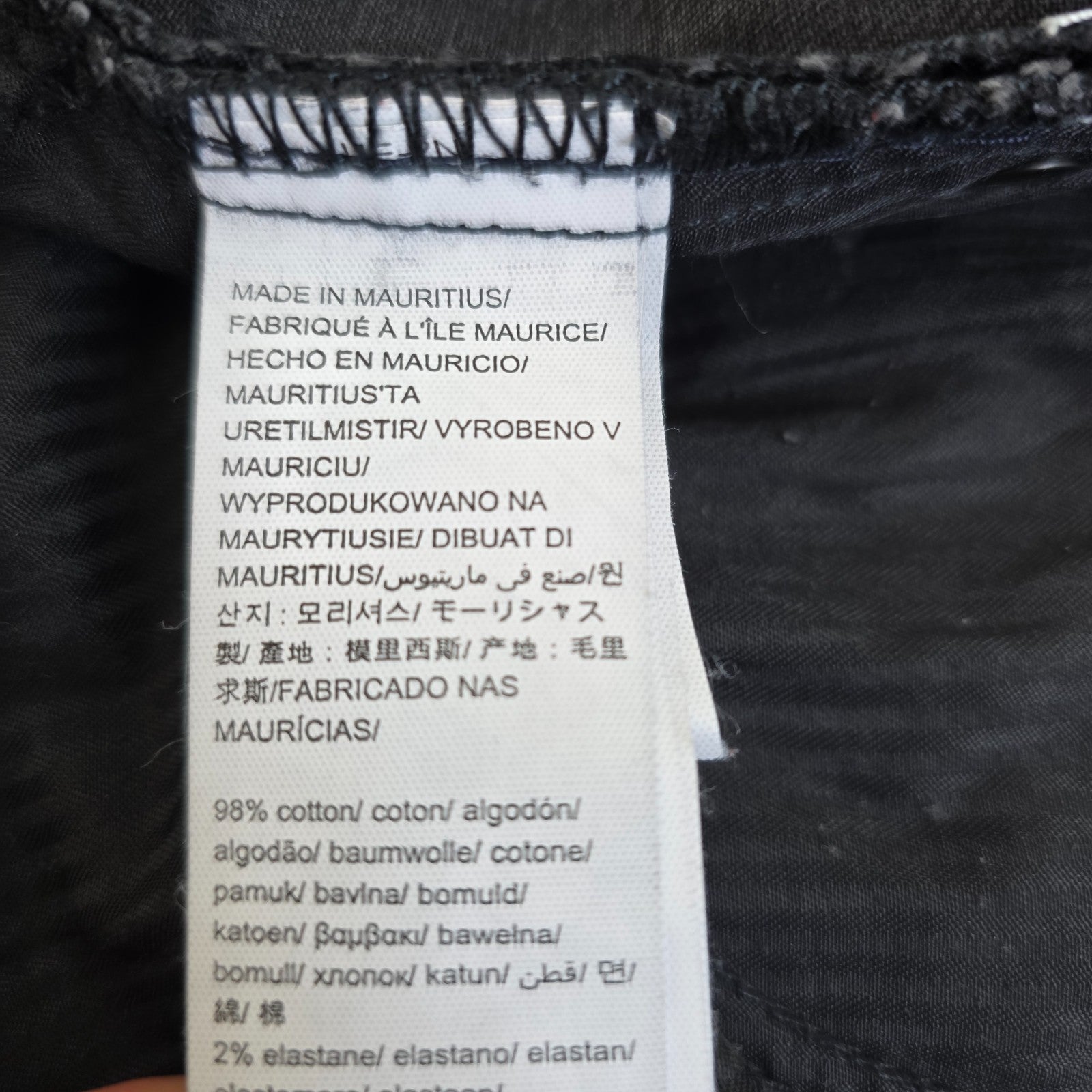 Calvin Klein black straight jeans with logo patch, stretch cotton blend, slim fit design.