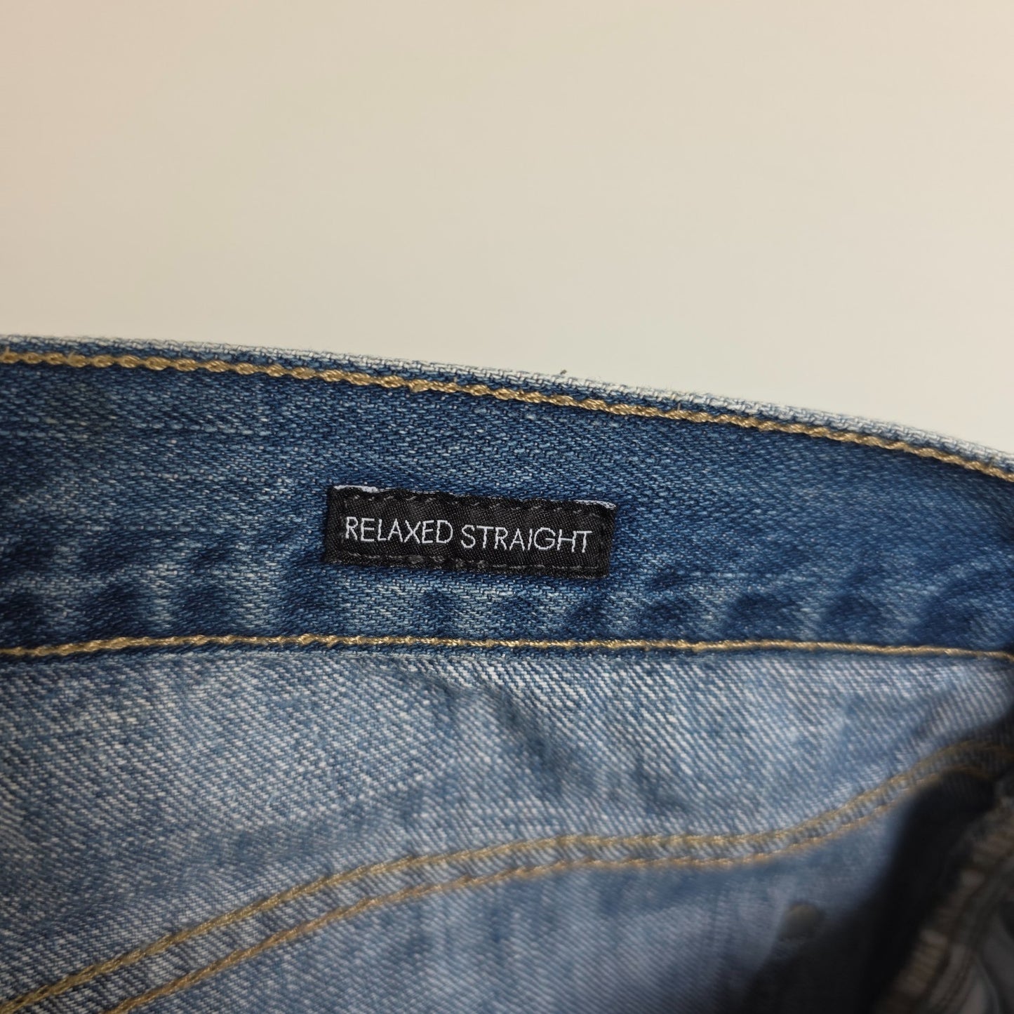 Calvin Klein blue straight jeans 100% cotton with relaxed fit and subtle logo detail.