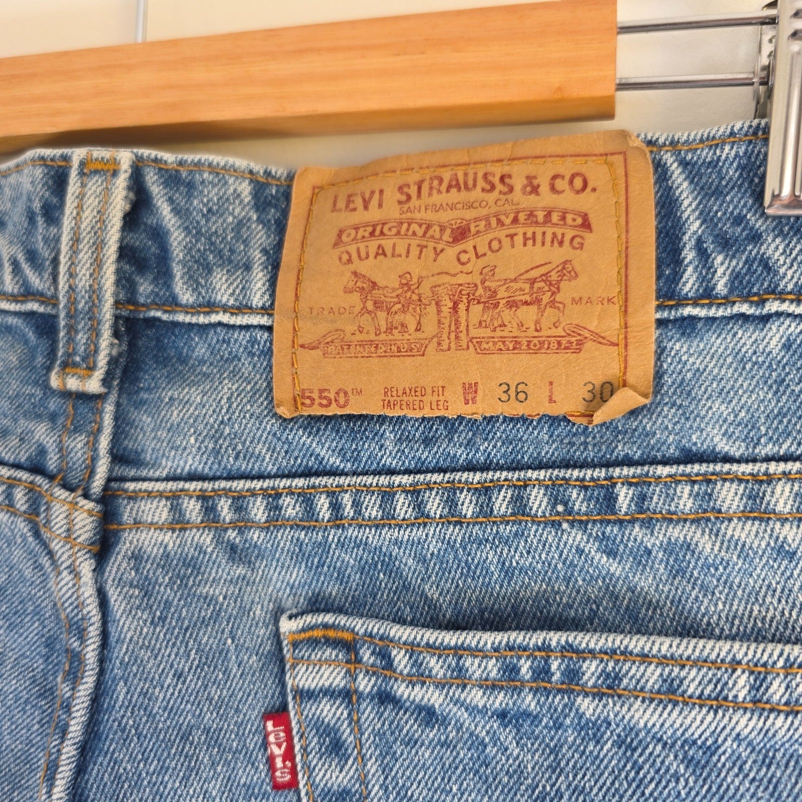 Levi's blue straight jeans vintage 550 relaxed fit with classic 90s silhouette.