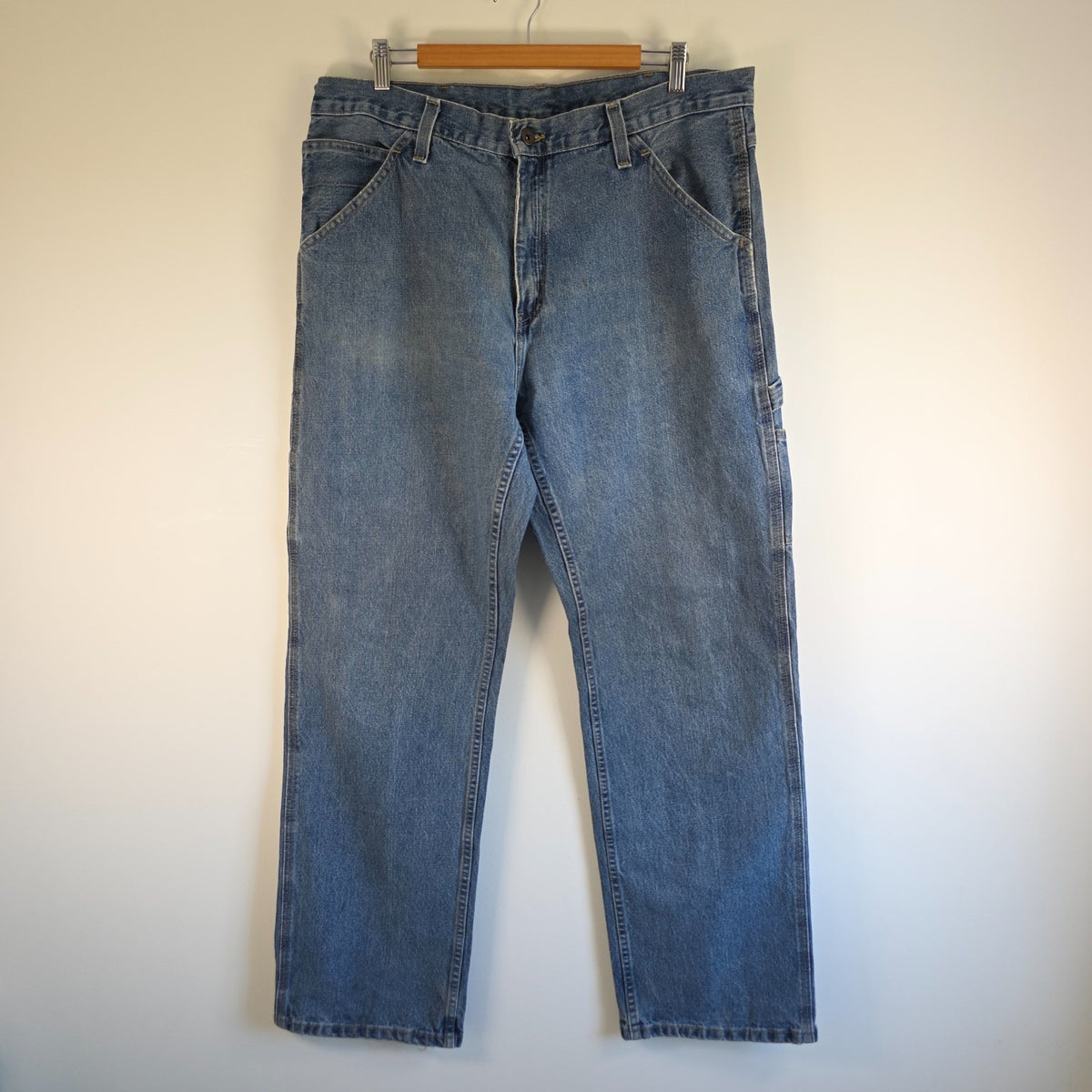 Faded Glory blue carpenter jeans with hammer loop and utility pockets, 100% cotton.