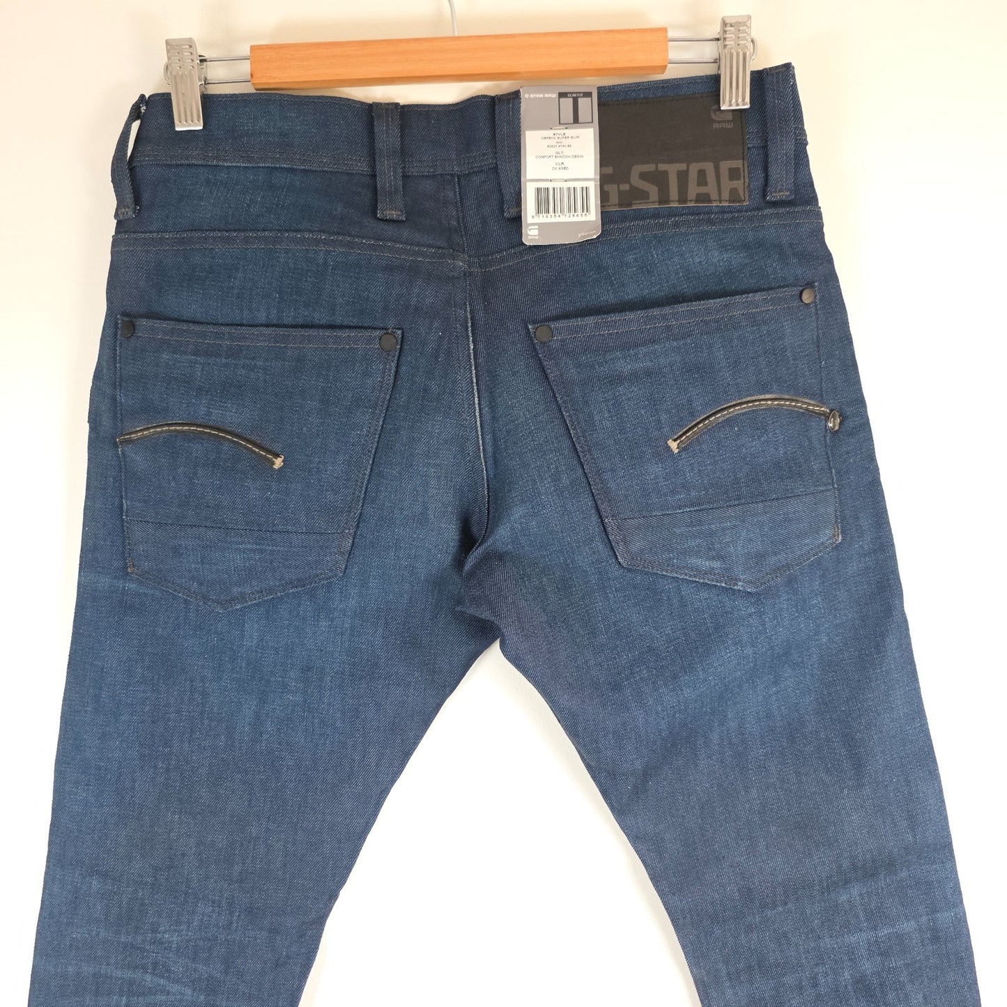 G-Star blue straight jeans with button fly and BNWT tag, cotton elastane blend.