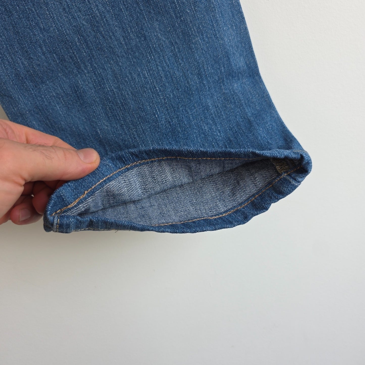 Calvin Klein blue straight jeans 100% cotton with relaxed fit and subtle logo detail.