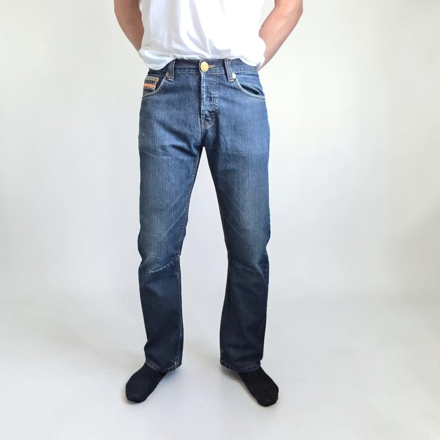 Superdry blue straight jeans with button fly, vintage raw denim, light wear.
