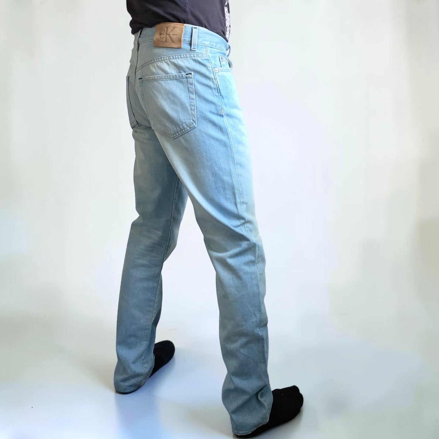 Calvin Klein light blue straight jeans, 100% cotton, classic five-pocket design.