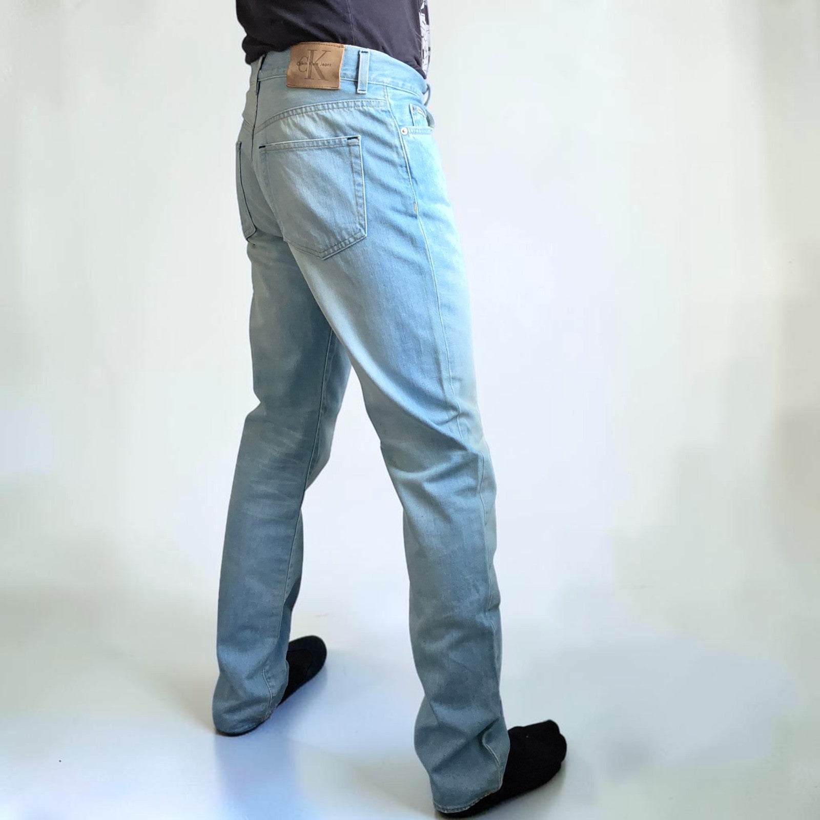Calvin Klein light blue straight jeans, 100% cotton, classic five-pocket design.