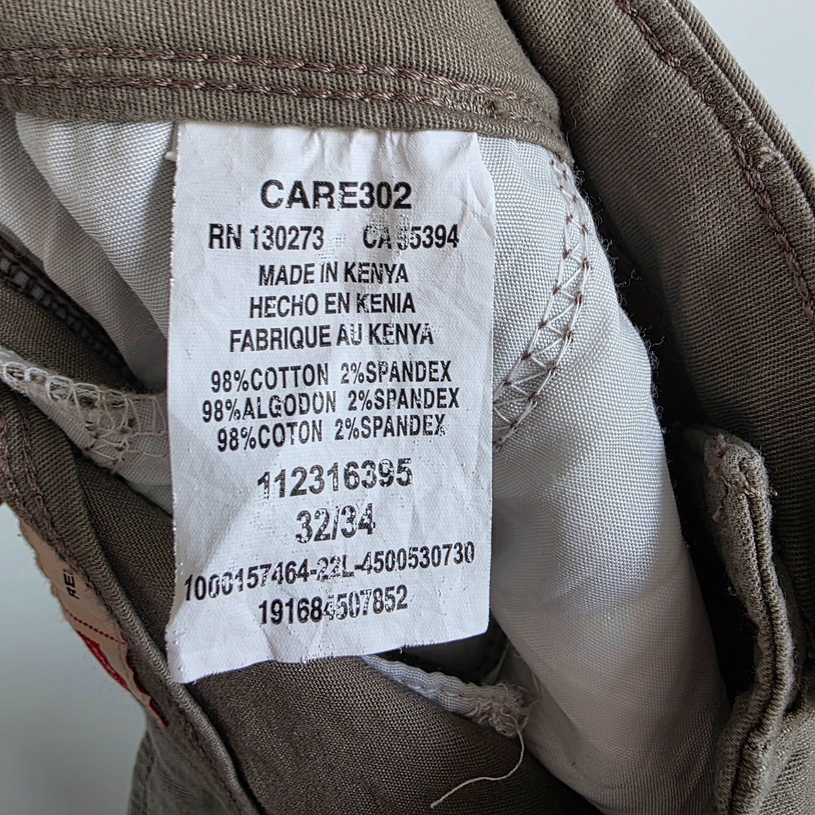 Wrangler khaki cargo trousers with utility pockets and cotton stretch fabric.