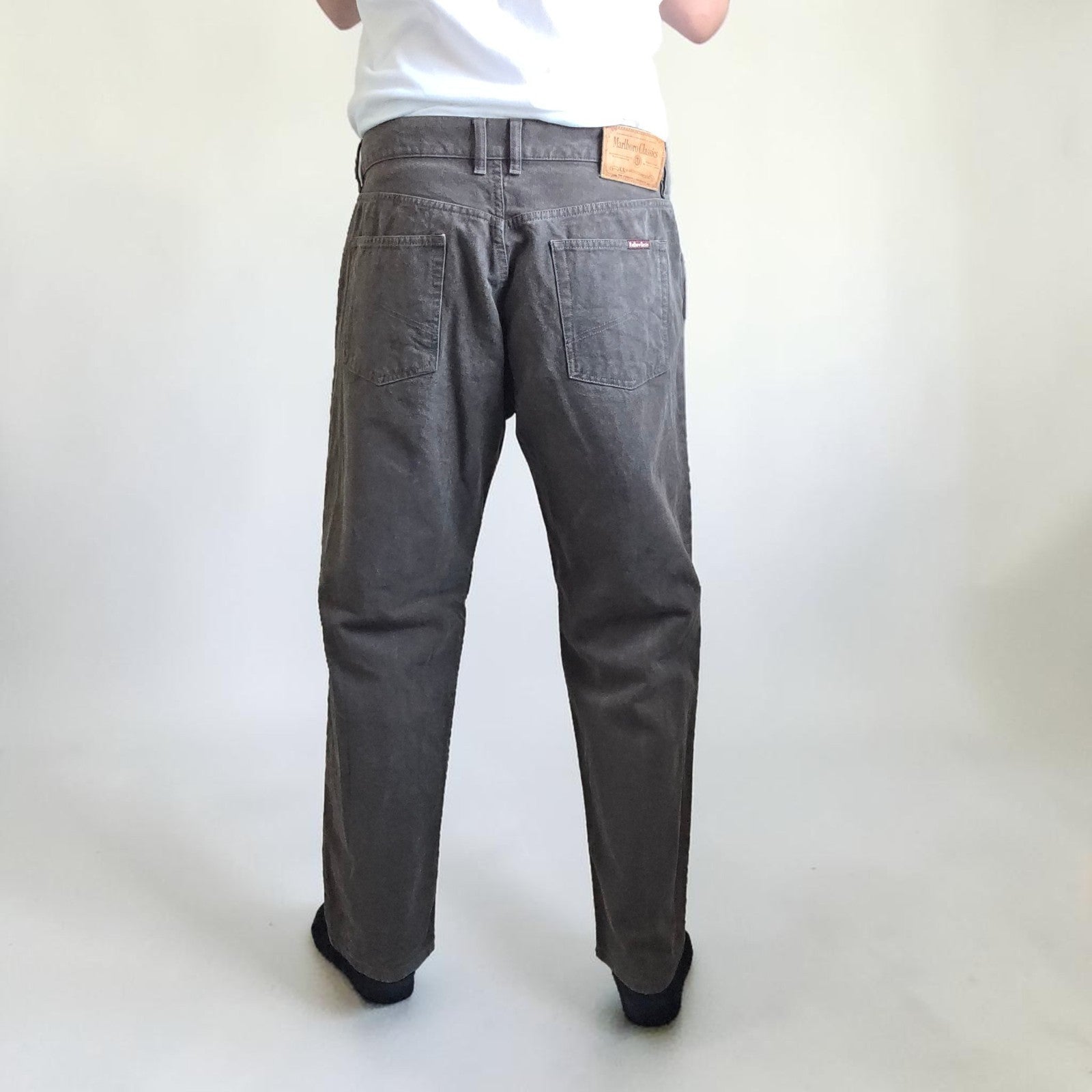 Marlboro Classics grey straight jeans with button fly and vintage logo detail.