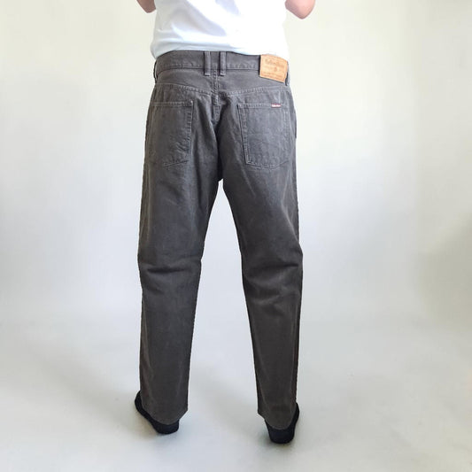 Marlboro Classics grey straight jeans with button fly and vintage logo detail.