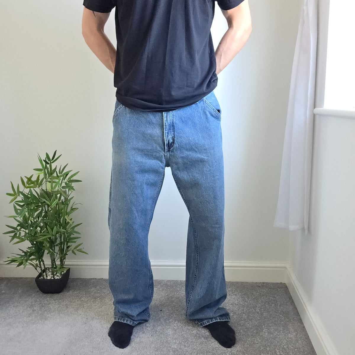 Faded Glory blue carpenter jeans with hammer loop and utility pockets, 100% cotton.
