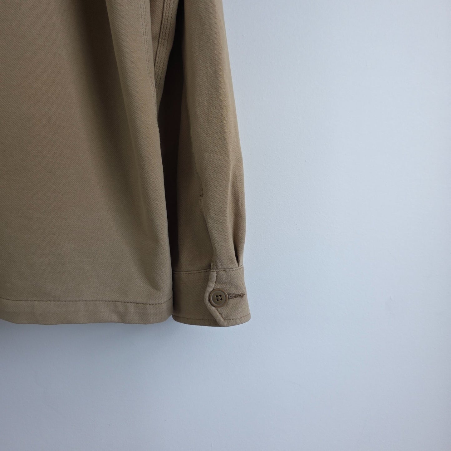 Uniqlo beige chore jacket cotton blend with stretch, classic workwear design.