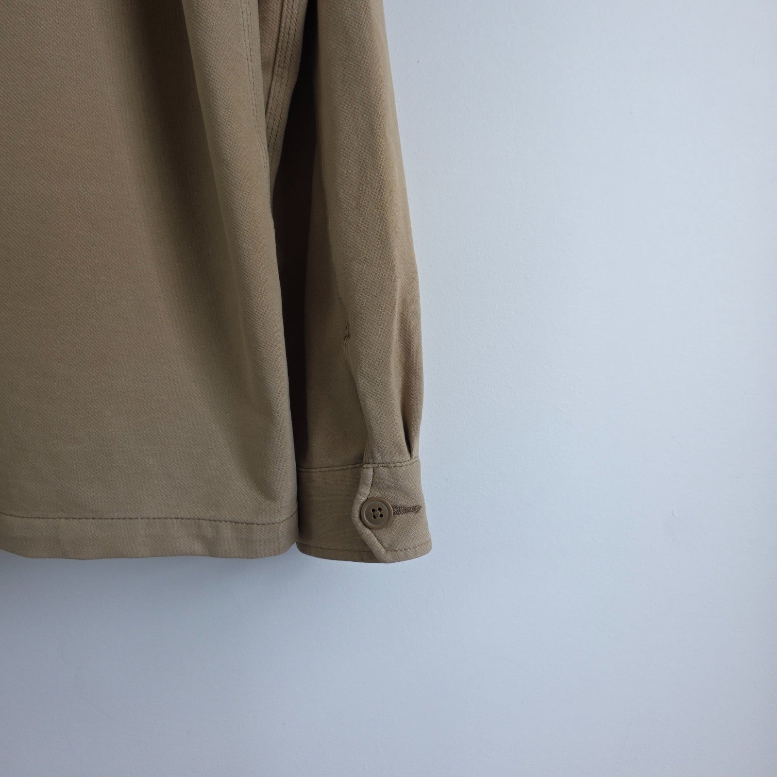 Uniqlo beige chore jacket cotton blend with stretch, classic workwear design.