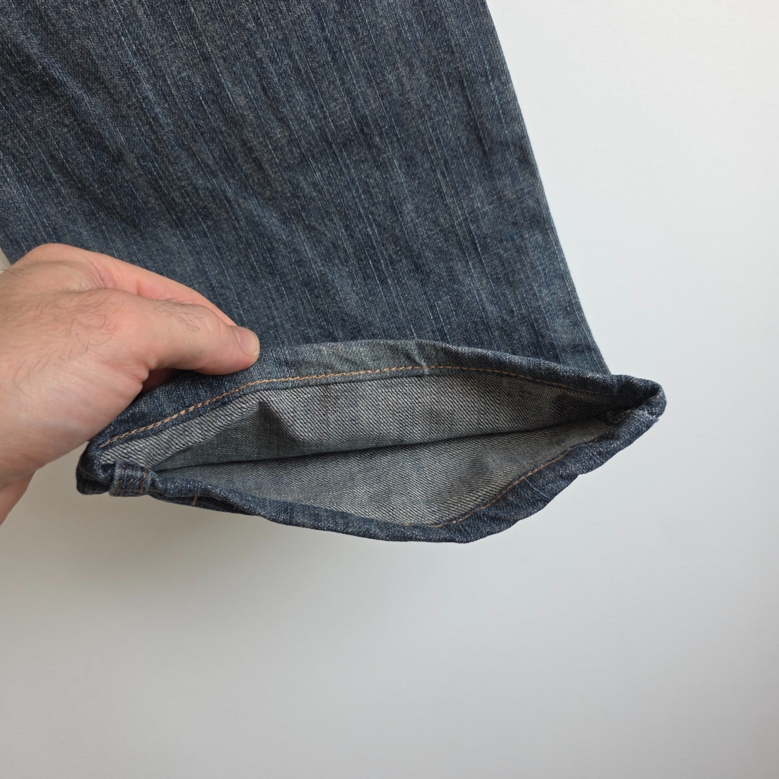 Wrangler blue straight jeans with relaxed fit, 100% cotton, professional hemmed to 30 inches.