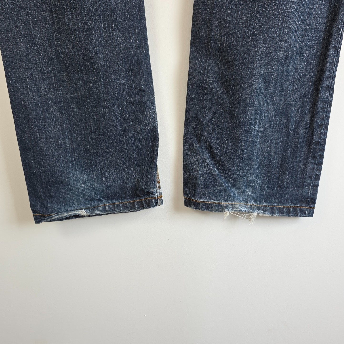 Superdry blue straight jeans with button fly, vintage raw denim, light wear.