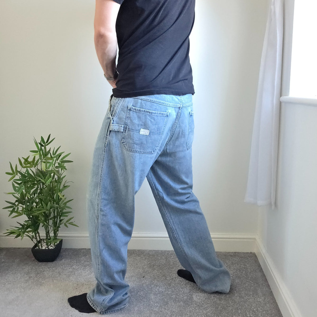 Old Navy blue carpenter jeans with hammer loop and utility pockets, 100% cotton.