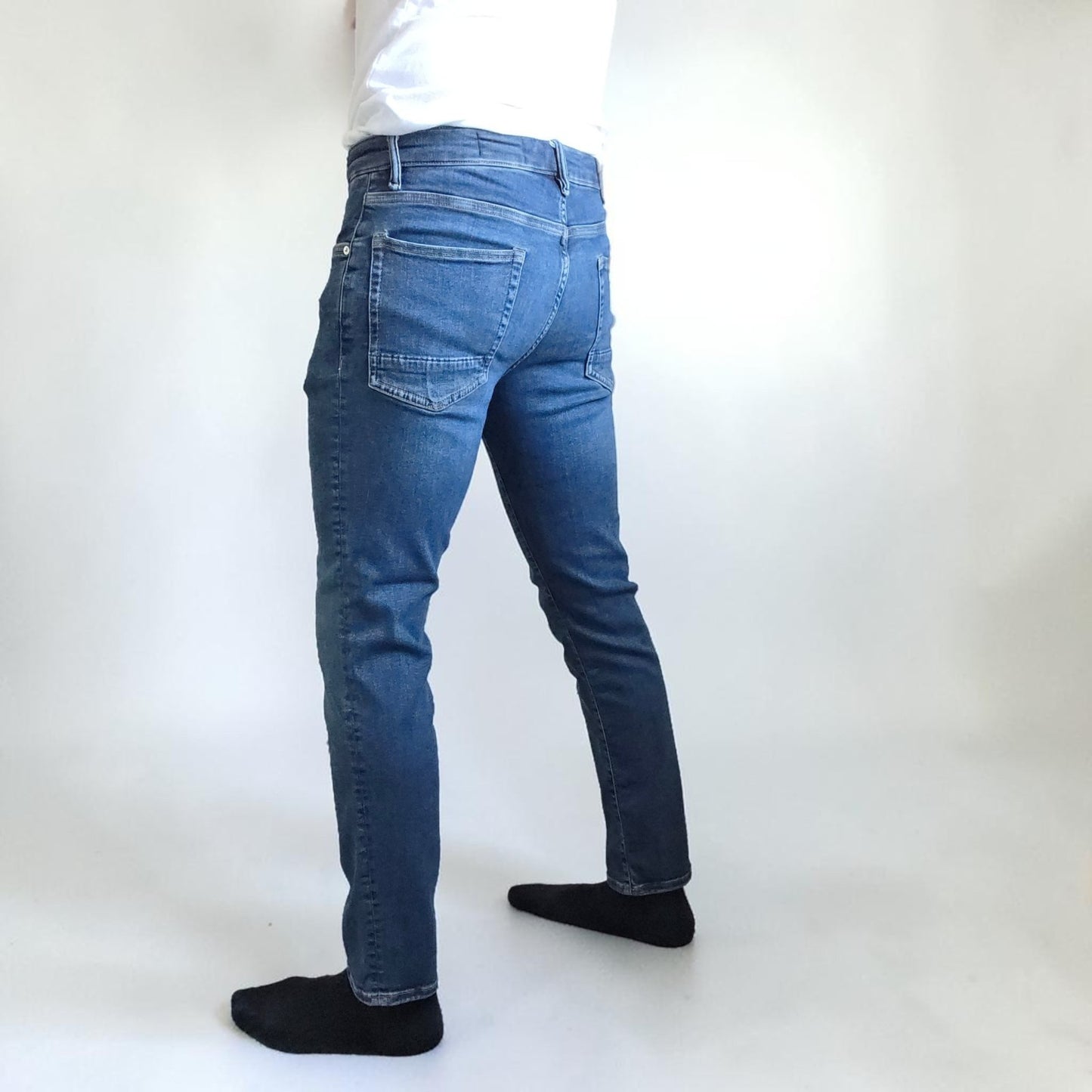 AllSaints blue straight jeans with button fly and stretch cotton-elastane blend.