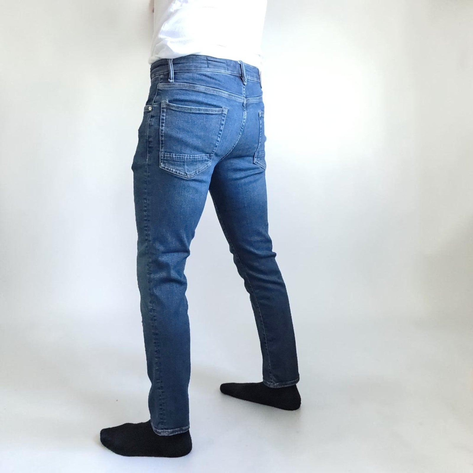 AllSaints blue straight jeans with button fly and stretch cotton-elastane blend.
