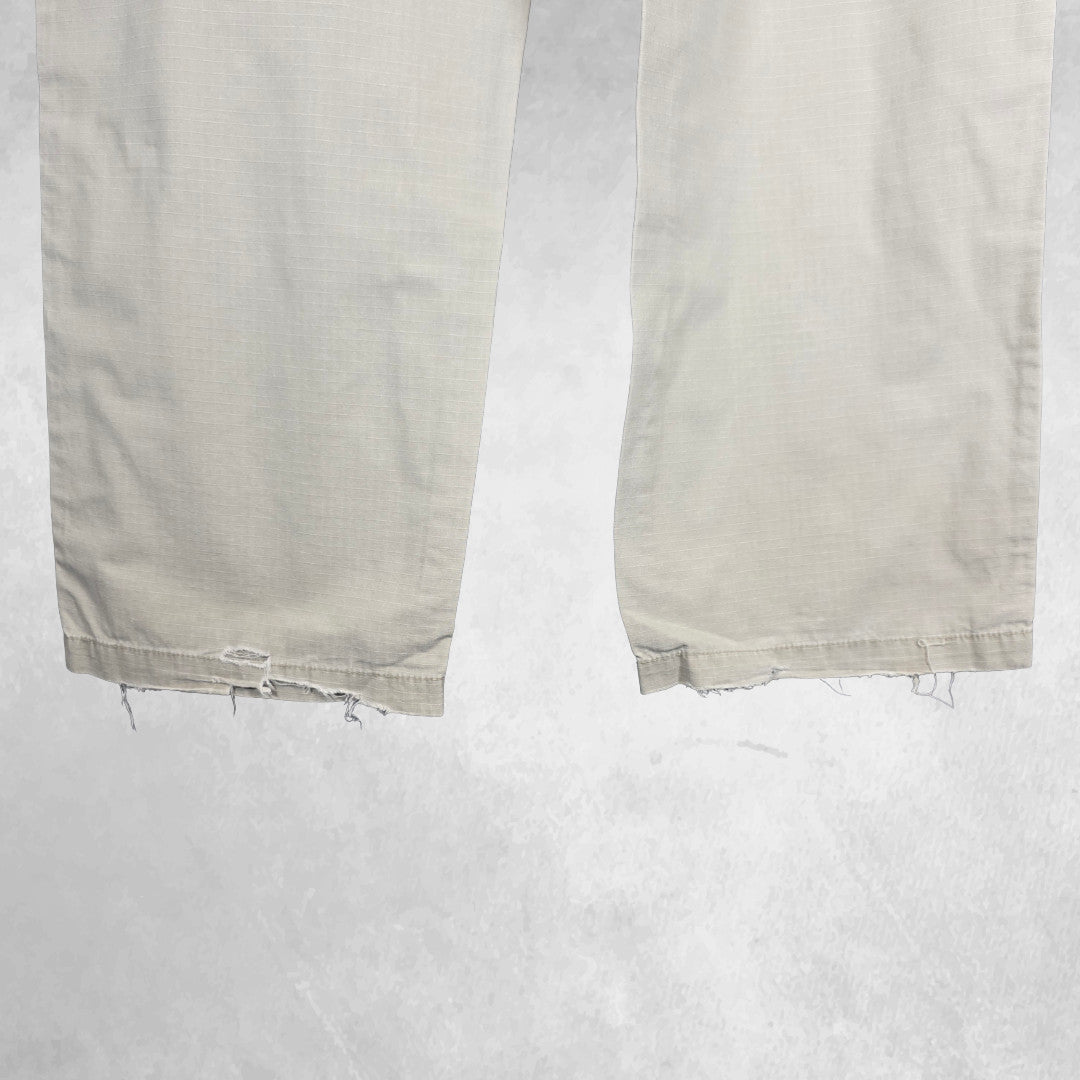 Polo Ralph Lauren beige cargo trousers with multiple pockets and straight leg cut.