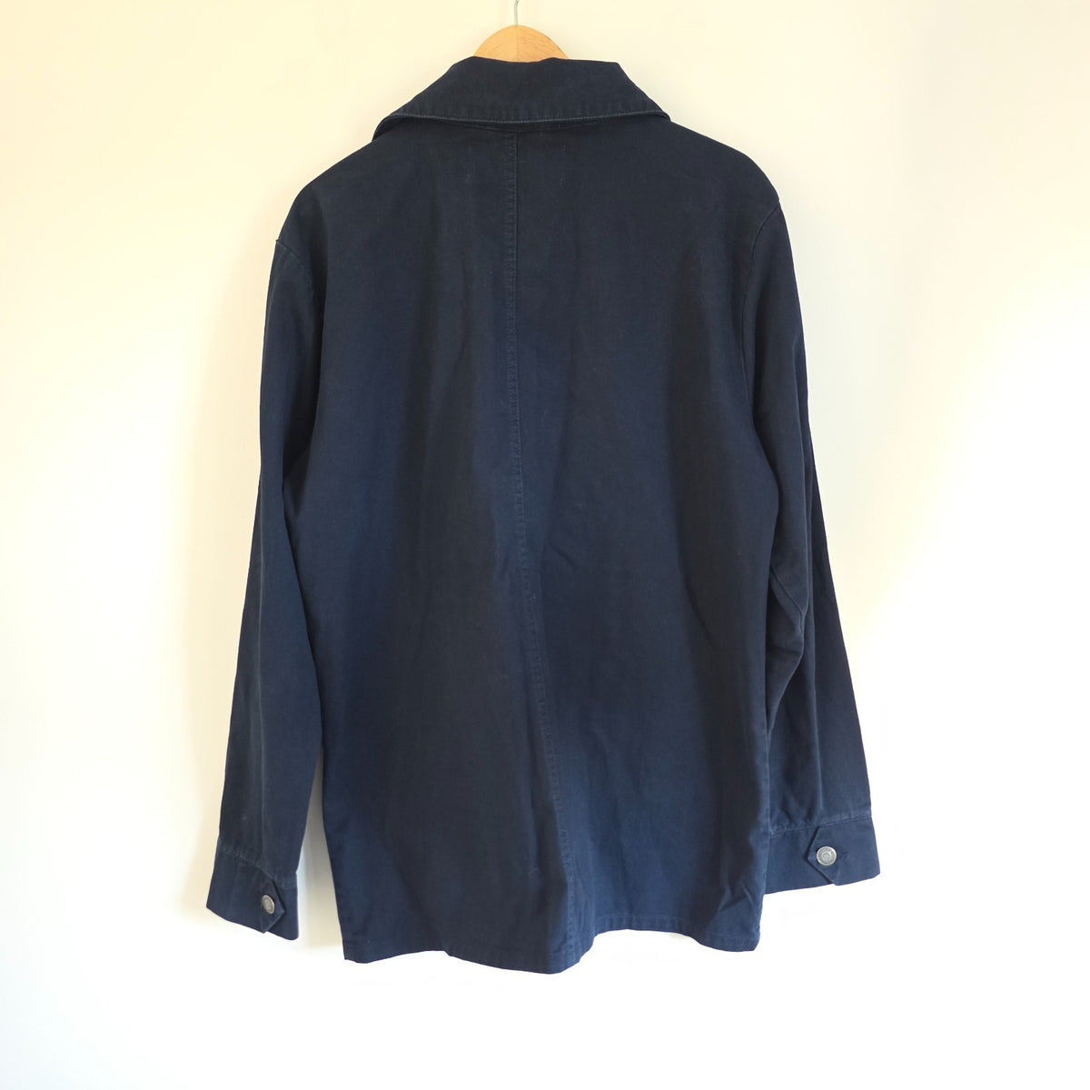 French Connection blue chore jacket with three patch pockets and metal button fastening.