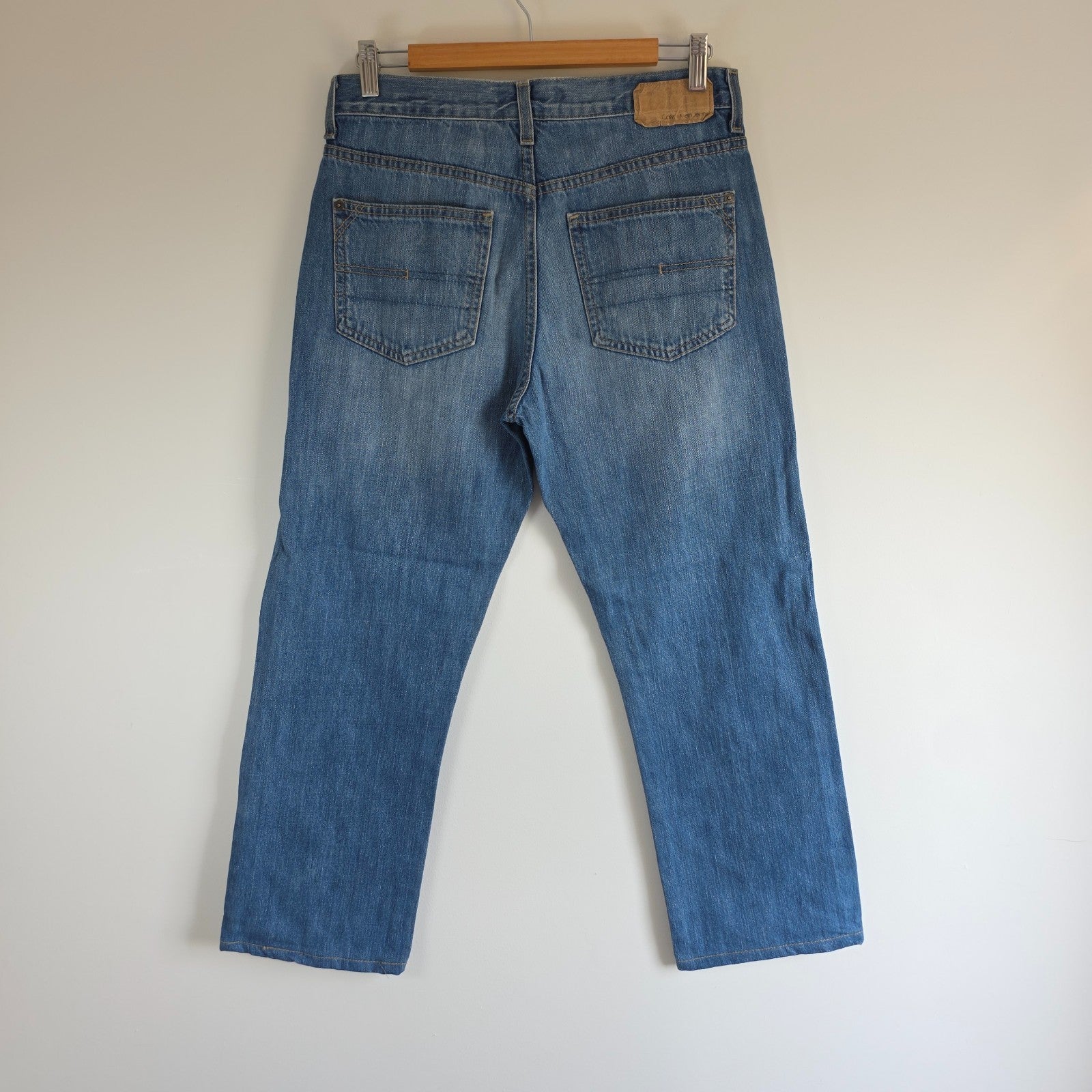 Calvin Klein blue straight jeans 100% cotton with relaxed fit and subtle logo detail.
