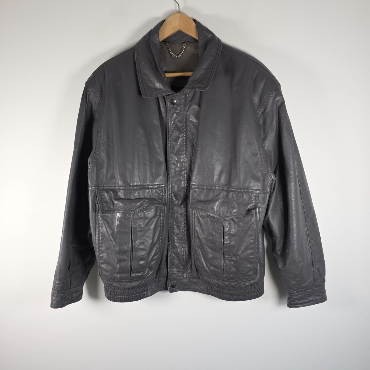 St Michael grey leather bomber jacket with utility pockets and elasticated waistband.