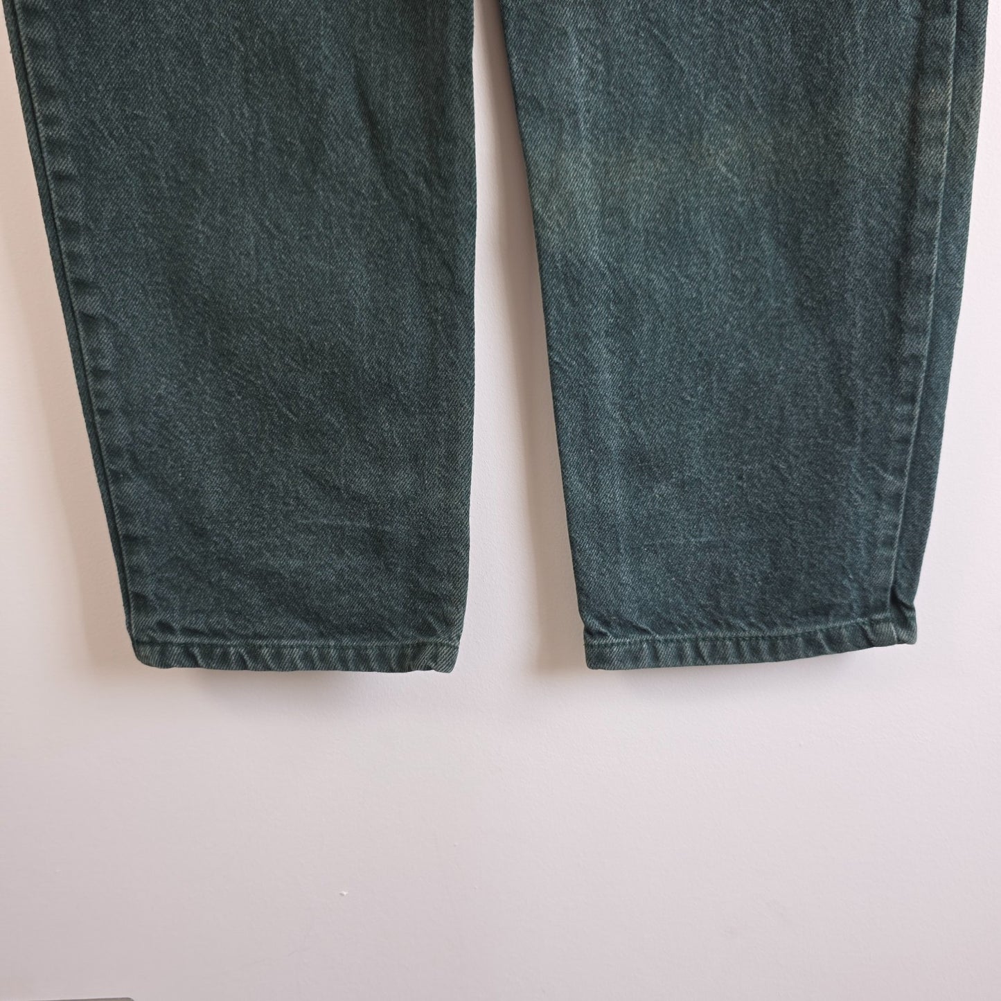Levi's 501 white jeans distressed with natural wear, made in USA, classic fit.