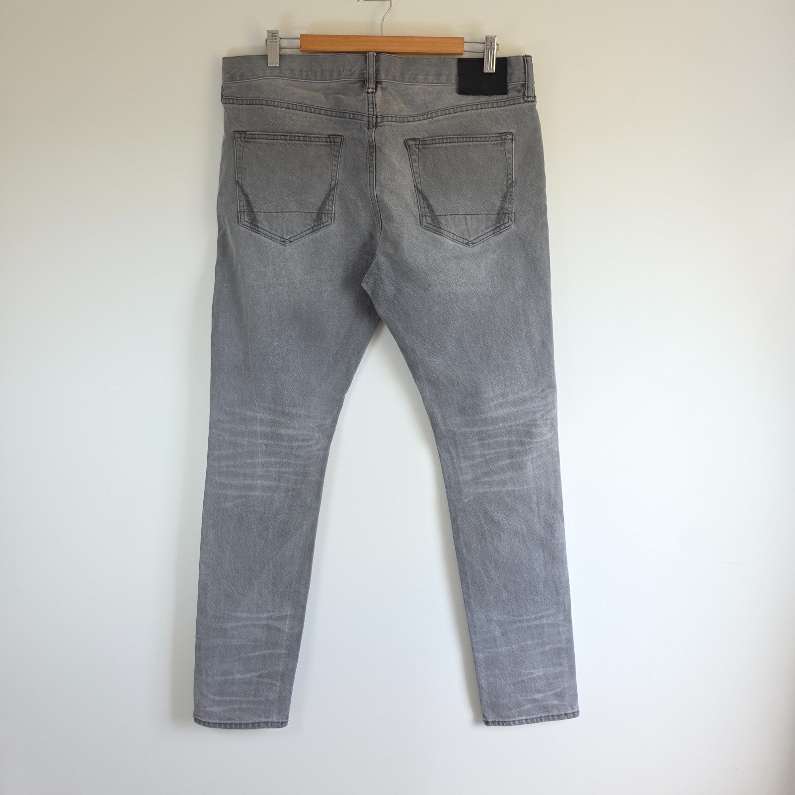 AllSaints grey slim jeans with button fly and stretch cotton elastane blend.