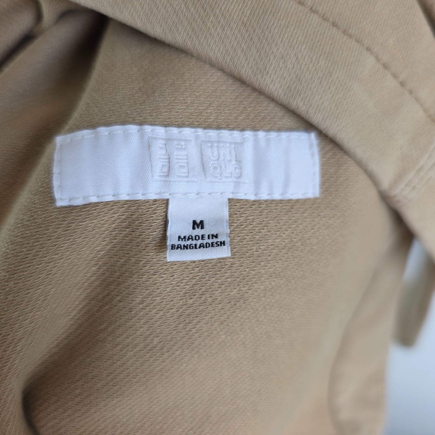 Uniqlo beige chore jacket cotton blend with stretch, classic workwear design.
