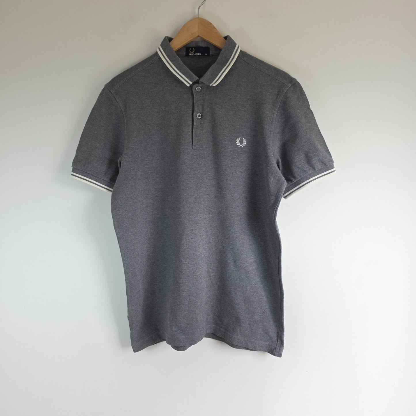 Fred Perry grey polo shirt with white twin tipping and classic laurel logo.
