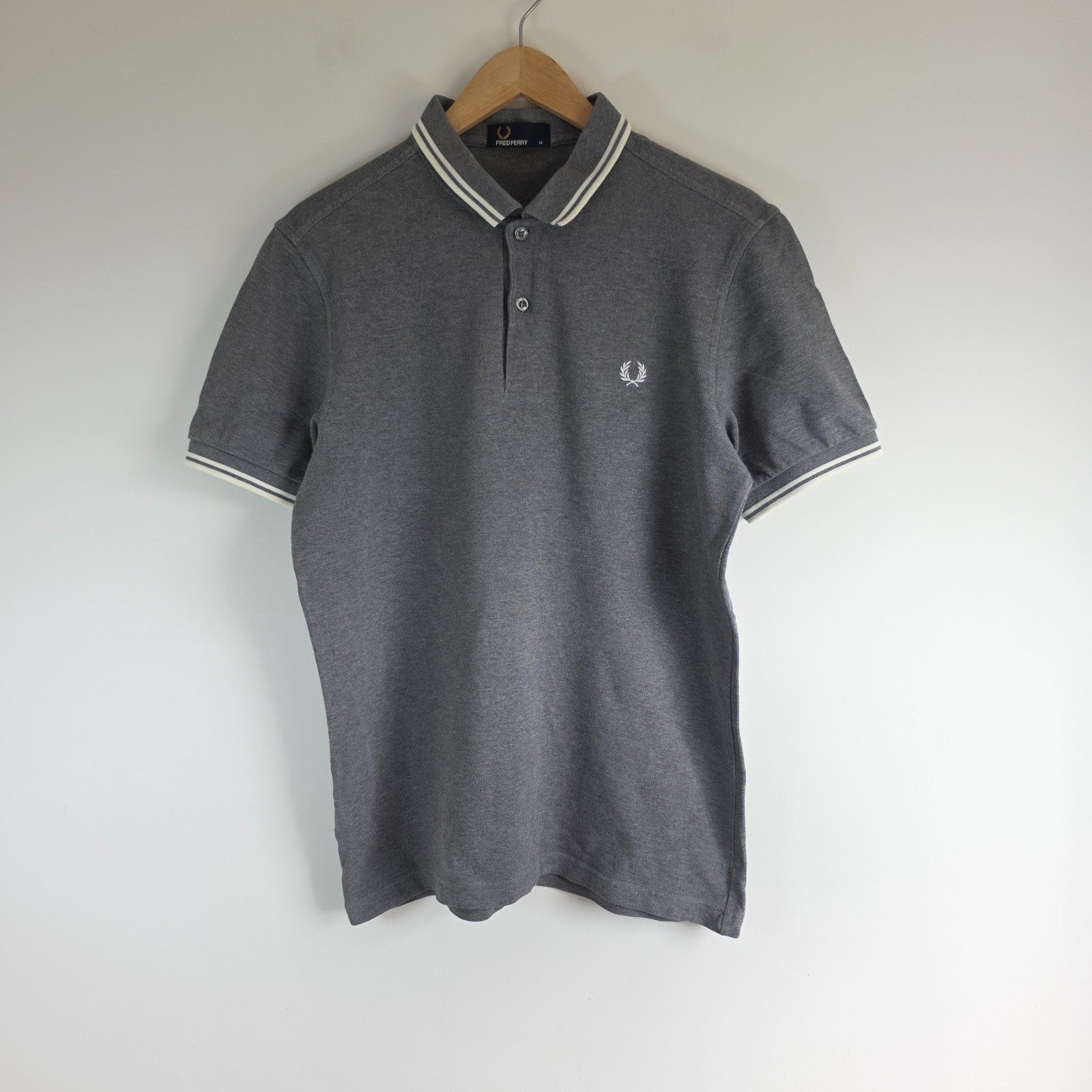 Fred Perry grey polo shirt with white twin tipping and classic laurel logo.