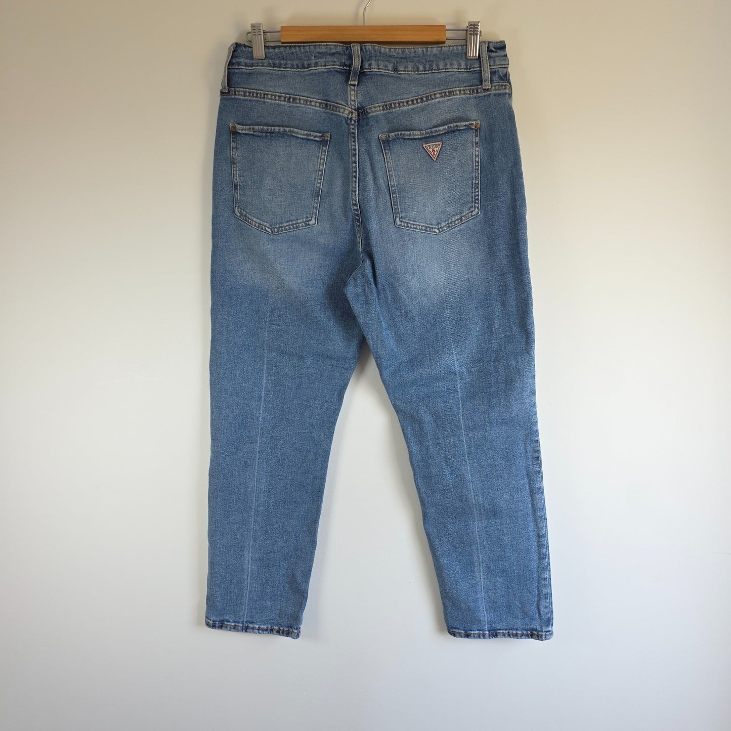 Vintage Guess blue cropped straight jeans with distressed details and high rise fit.
